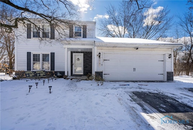 view of front of property with a garage