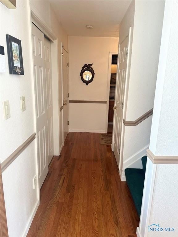 hallway with wood finished floors