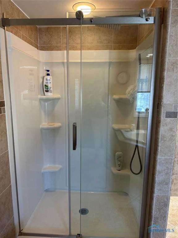 bathroom featuring a shower stall