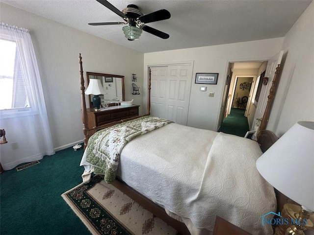 bedroom featuring baseboards, carpet, a ceiling fan, and a closet