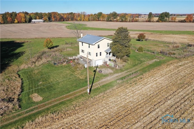 birds eye view of property with a rural view