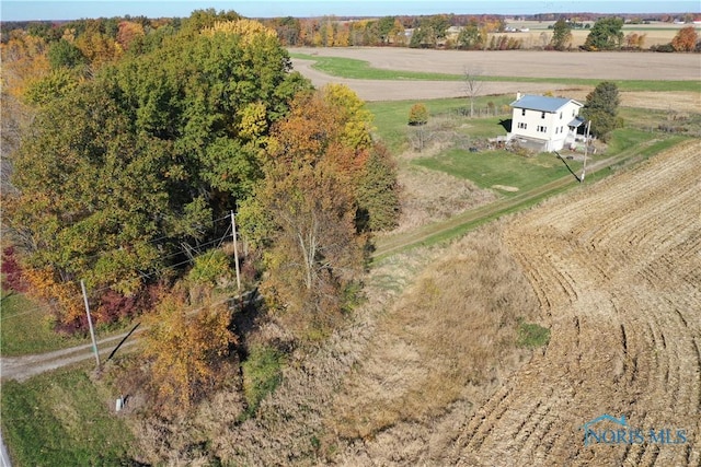 birds eye view of property with a rural view