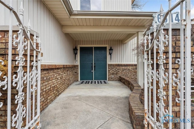 entrance to property with brick siding