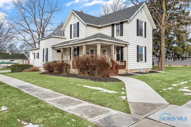 view of front of home with a porch, roof with shingles, and a front lawn