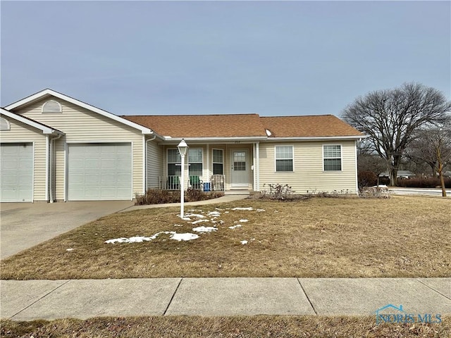 ranch-style home with a garage, covered porch, and driveway