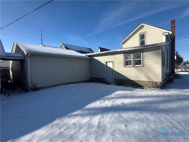 view of snow covered property