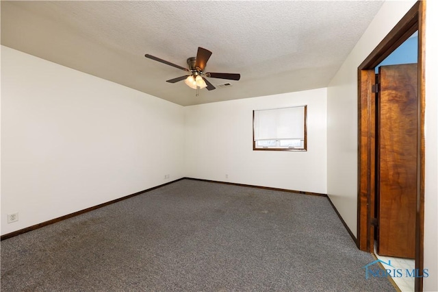 carpeted spare room featuring visible vents, ceiling fan, a textured ceiling, and baseboards