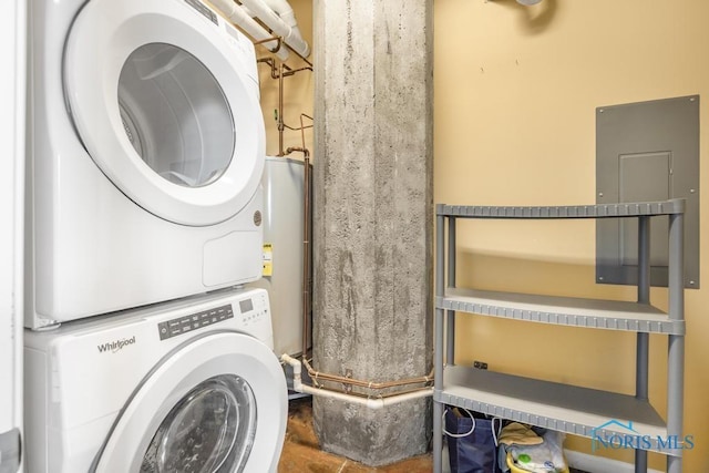 laundry area featuring stacked washer / dryer