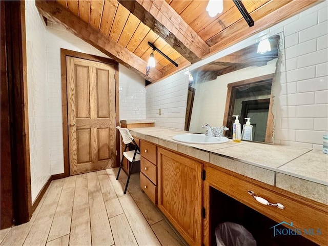 3190 Rd 204, Antwerp, OH 45813 - bathroom with a wooden ceiling with exposed beams, wood finished floors, and vanity