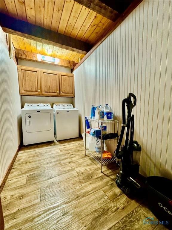 3190 Rd 204, Antwerp, OH 45813 - washroom featuring washer and clothes dryer, light wood-style floors, cabinet space, and wood ceiling