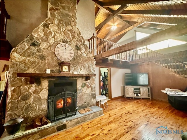3190 Rd 204, Antwerp, OH 45813 - living room featuring high vaulted ceiling, stairway, wood-type flooring, a fireplace, and a wood ceiling with exposed beams