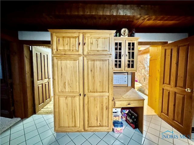 3190 Rd 204, Antwerp, OH 45813 - kitchen with light tile patterned flooring, wood ceiling, glass insert cabinets, light brown cabinetry, and light countertops
