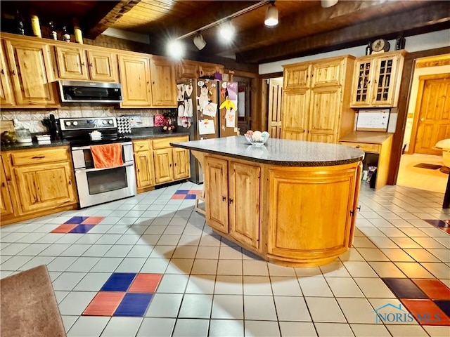 3190 Rd 204, Antwerp, OH 45813 - kitchen with stainless steel appliances, rail lighting, a wooden ceiling with exposed beams, dark countertops, and tasteful backsplash