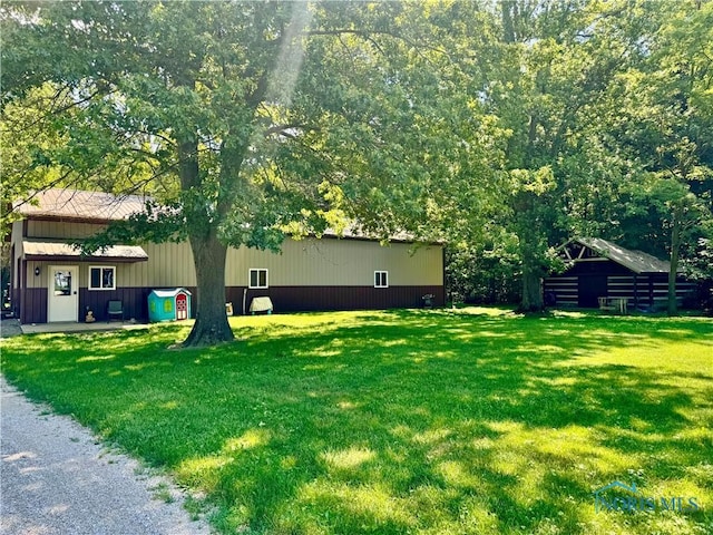 3190 Rd 204, Antwerp, OH 45813 - view of green lawn with a pole building and an outdoor structure