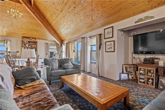 living area featuring carpet, lofted ceiling with beams, wooden ceiling, and a healthy amount of sunlight