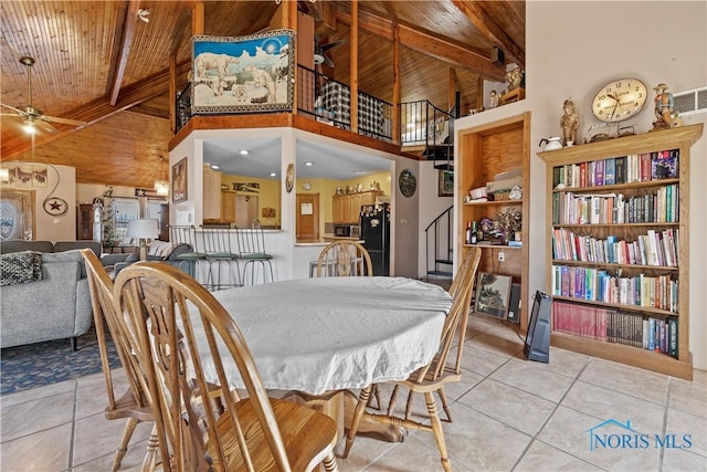 dining room featuring wooden ceiling, stairs, beam ceiling, and light tile patterned flooring