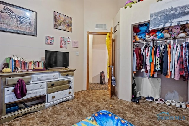 bedroom featuring visible vents, a closet, and carpet flooring