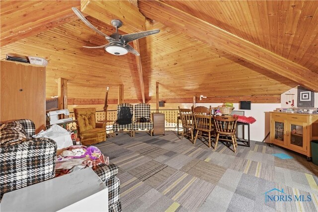 interior space with lofted ceiling with beams, wood walls, carpet, and wooden ceiling