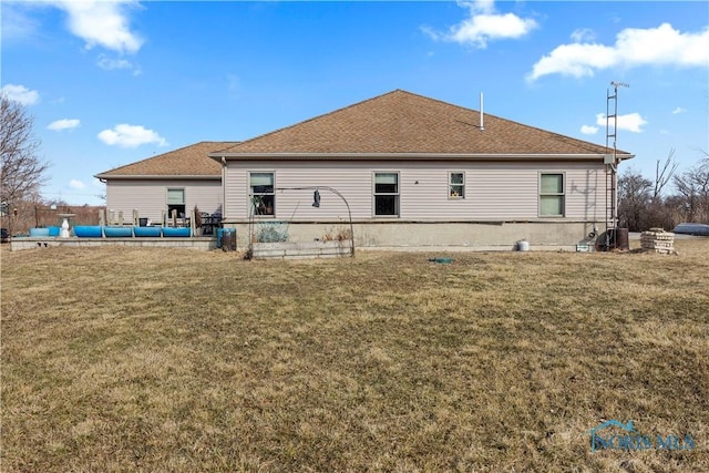 rear view of house with a lawn