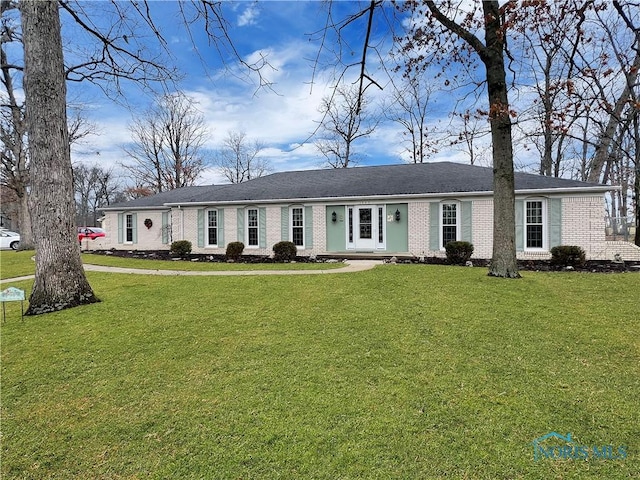 ranch-style house with brick siding and a front lawn