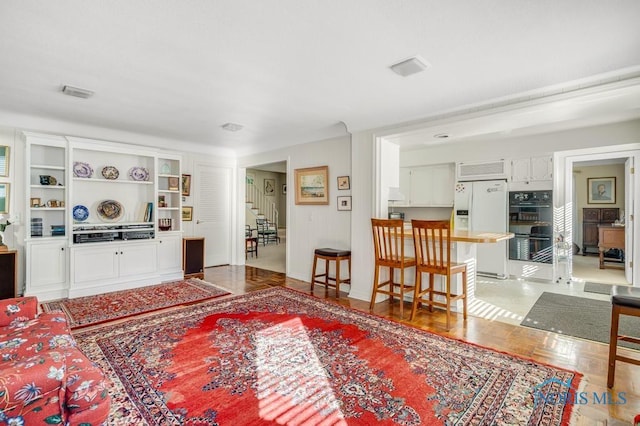 living room featuring stairway