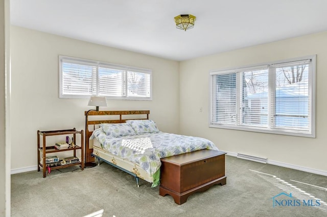 bedroom featuring baseboards and light colored carpet