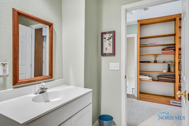 bathroom featuring visible vents and vanity