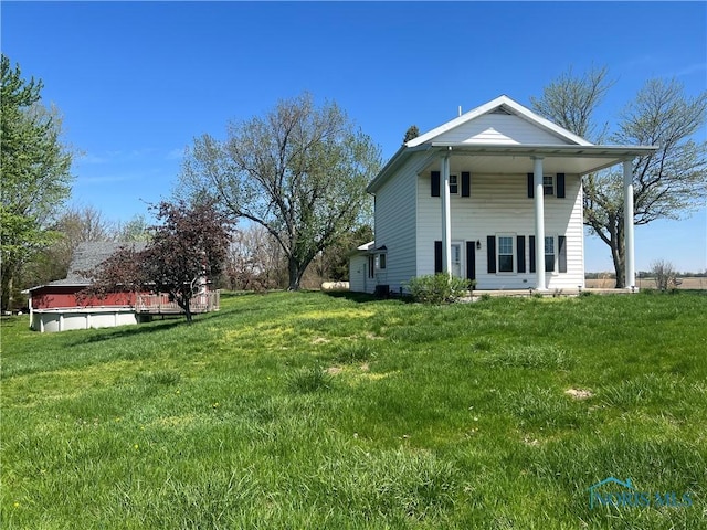 17020 State Route 2, Wauseon, OH 43567 - rear view of house with a yard