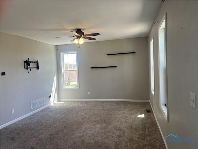17020 State Route 2, Wauseon, OH 43567 - carpeted spare room featuring visible vents, baseboards, and ceiling fan