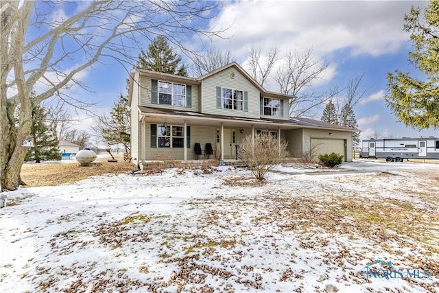 view of front of property featuring an attached garage, driveway, and a porch