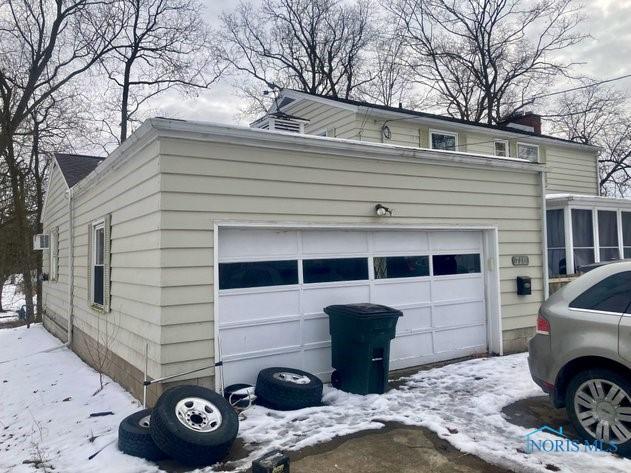 view of snow covered garage