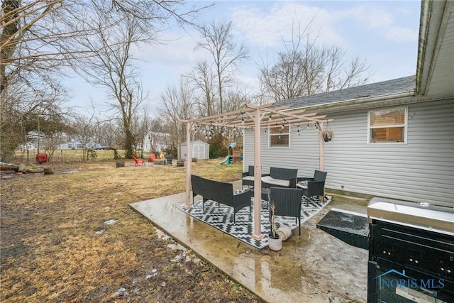 view of patio featuring a storage unit, outdoor lounge area, a pergola, and an outbuilding