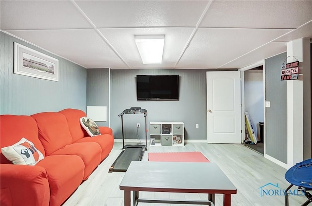 living room featuring baseboards and wood finished floors