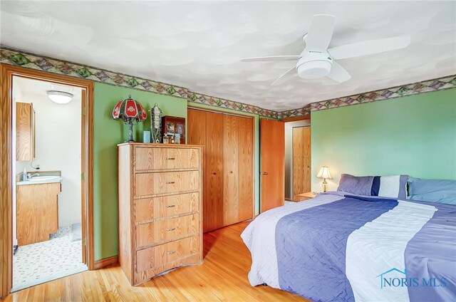 bedroom featuring ceiling fan and light wood-style flooring