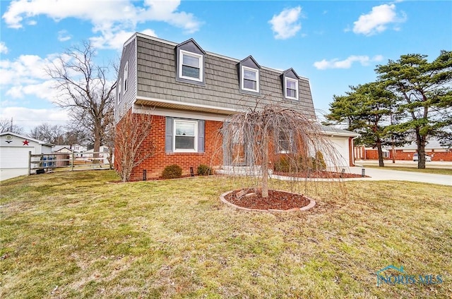 view of front of property featuring mansard roof, a front lawn, fence, and brick siding