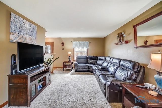 living area with carpet and baseboards