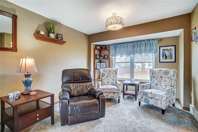 sitting room with carpet floors and baseboards