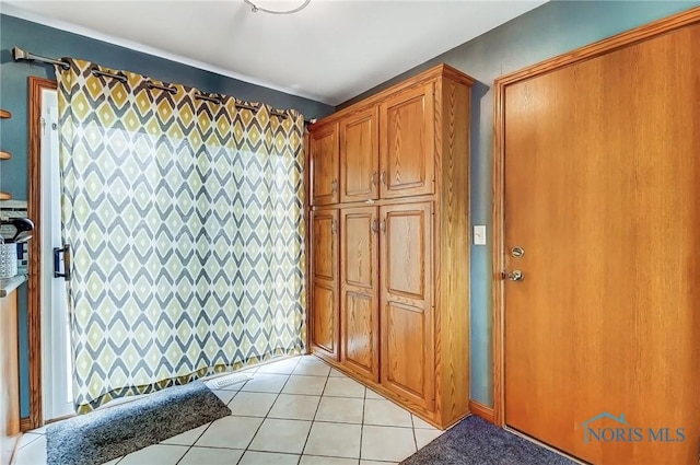 interior space featuring light tile patterned floors