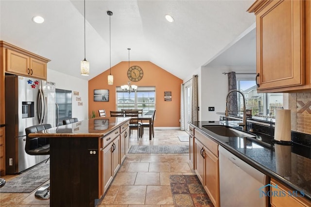 kitchen with tasteful backsplash, lofted ceiling, stainless steel fridge with ice dispenser, a sink, and dishwashing machine