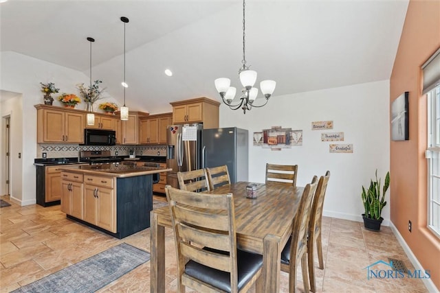 dining area featuring baseboards, vaulted ceiling, and a notable chandelier