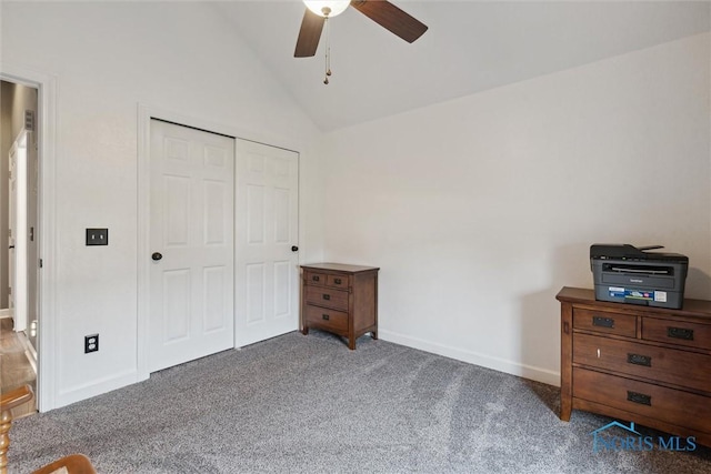 carpeted bedroom featuring lofted ceiling, a closet, ceiling fan, and baseboards