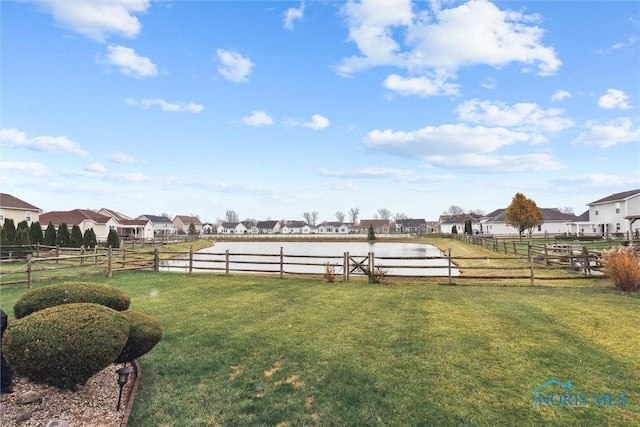 view of yard with an enclosed area and a residential view