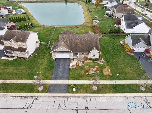 aerial view with a water view and a residential view