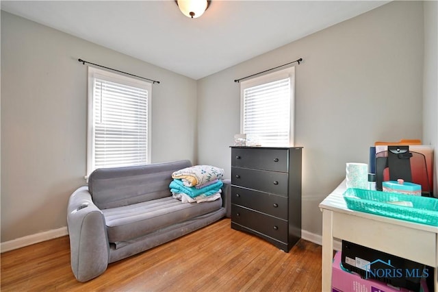 sitting room featuring wood finished floors and baseboards