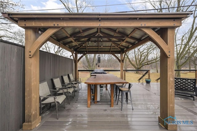 wooden terrace featuring a gazebo