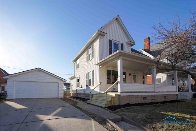 view of front of house featuring an outbuilding, a porch, a chimney, and a garage