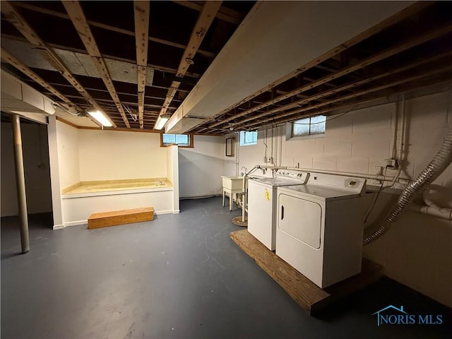 basement with separate washer and dryer