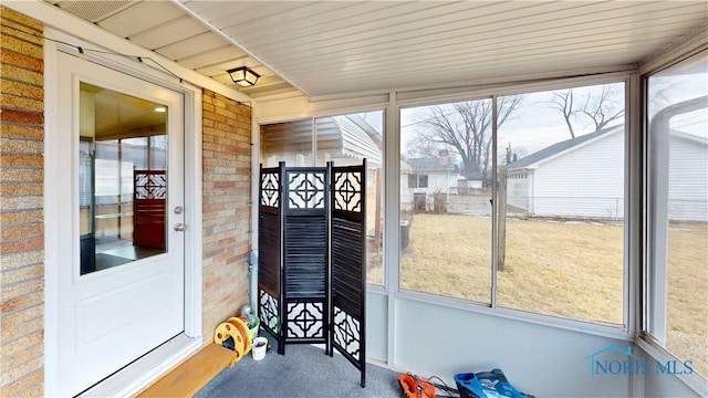 sunroom / solarium featuring plenty of natural light