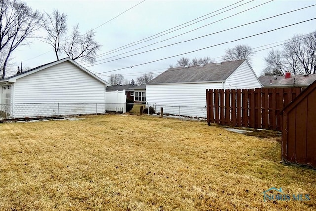 view of yard with a fenced backyard