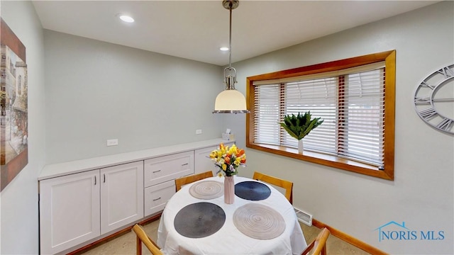 dining room featuring recessed lighting